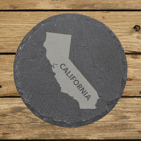 California round slate coaster engraved with the state shape and CALIFORNIA in bold lettering