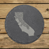 California round slate coaster engraved with the state shape in ornate floral scrollwork