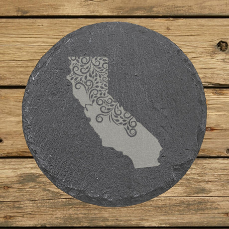 California round slate coaster engraved with the state shape in ornate floral scrollwork