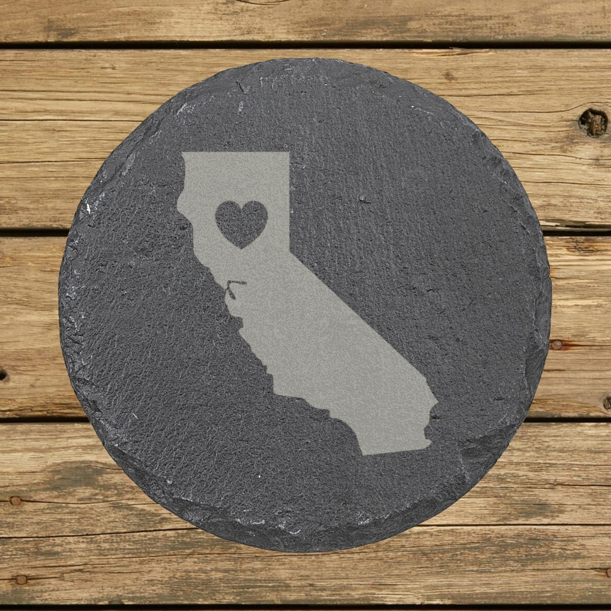 California round slate coaster engraved with the state shape and a heart