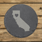 California round slate coaster engraved with the state shape and a heart