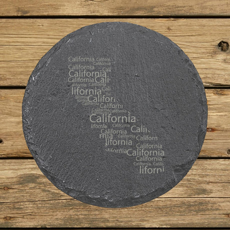 California round slate coaster engraved with a word cloud of repeating California text