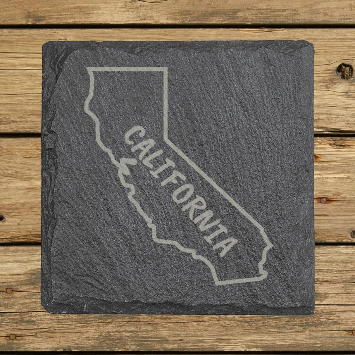 California square slate coaster engraved with the state outline and CALIFORNIA in hand-drawn brush lettering