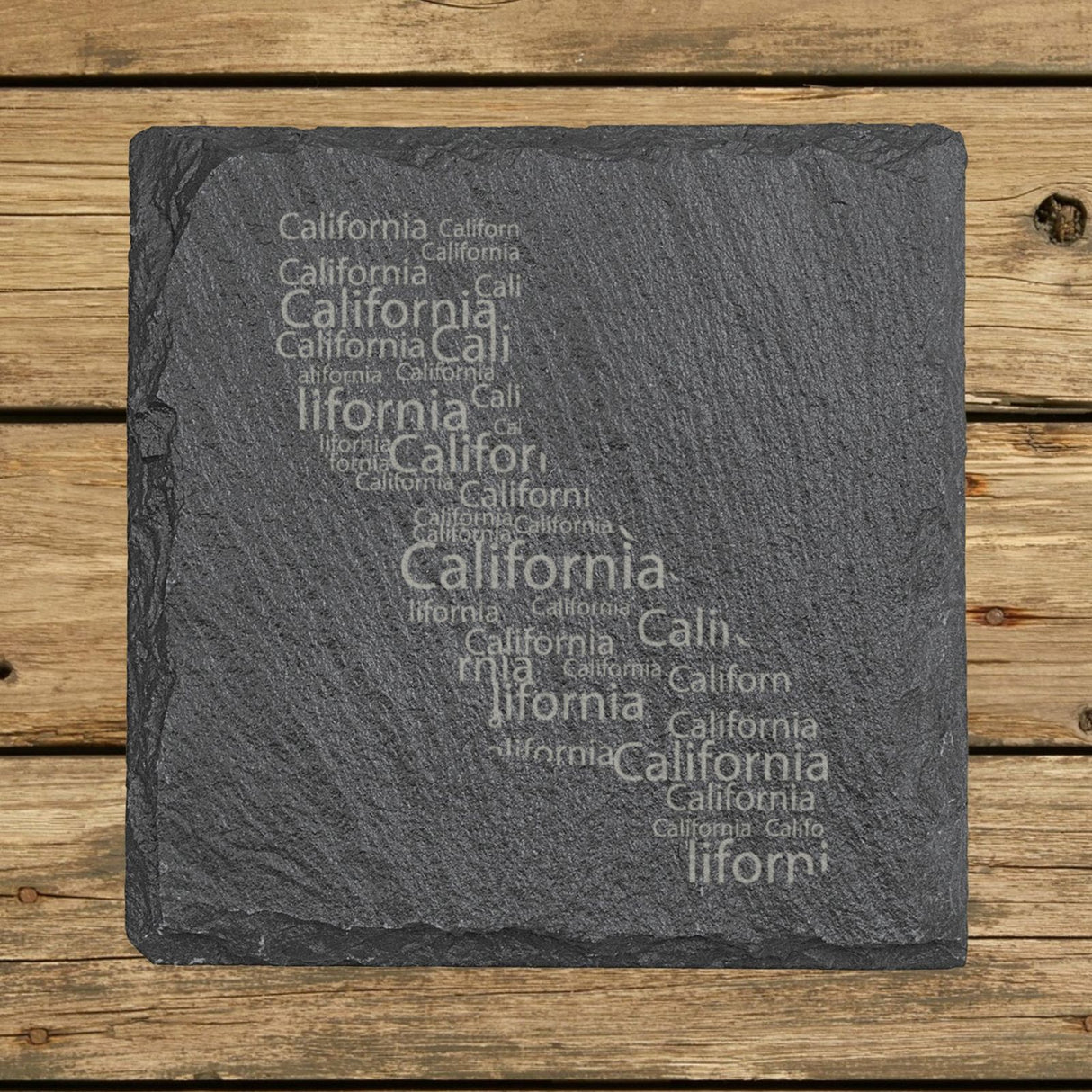 California square slate coaster engraved with a word cloud of repeating California text