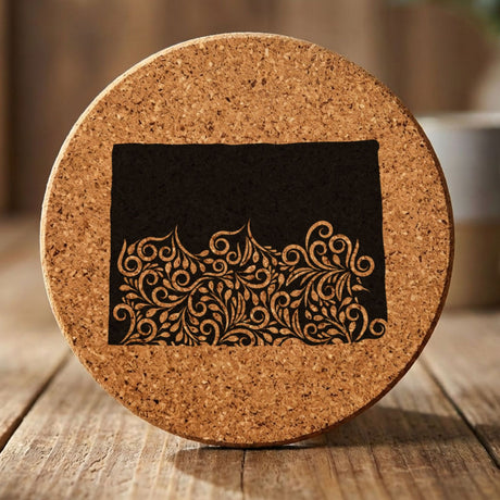 Colorado round cork coaster engraved with the state shape in ornate floral scrollwork