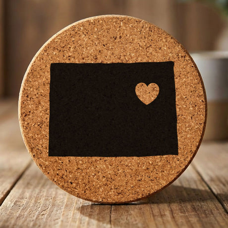 Colorado round cork coaster engraved with the state shape and a heart