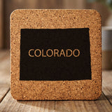 Colorado square cork coaster engraved with the state shape and COLORADO in bold lettering