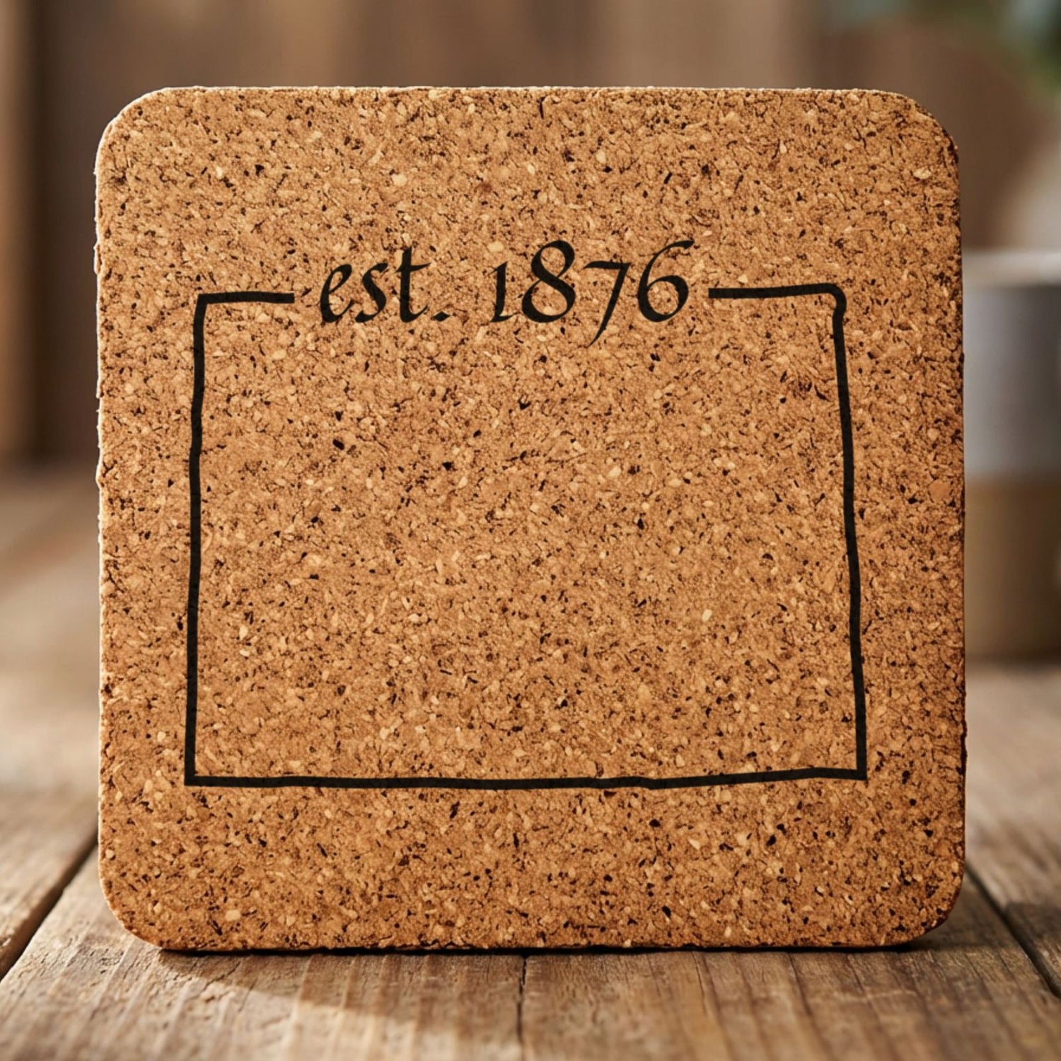 Colorado square cork coaster engraved with the state outline and est. 1876