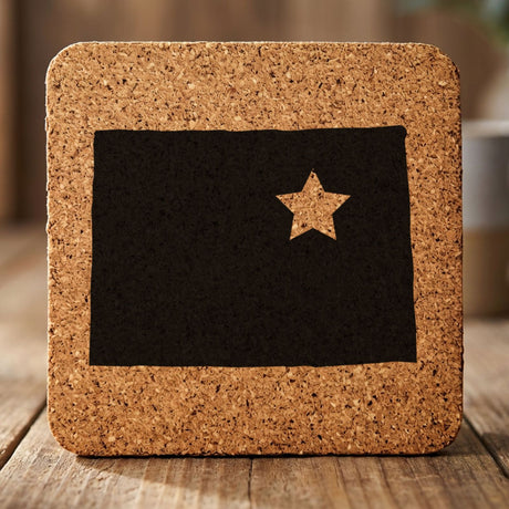 Colorado square cork coaster engraved with the state shape and a star