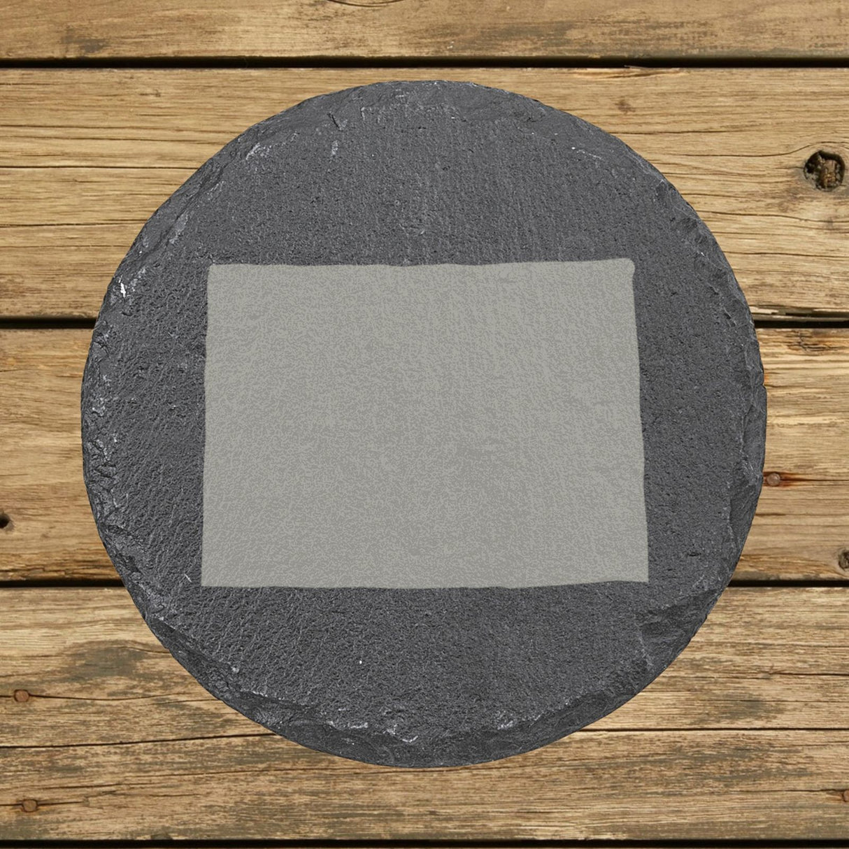 Colorado round slate coaster with the full state shape engraved