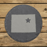 Colorado round slate coaster engraved with the state shape and a star