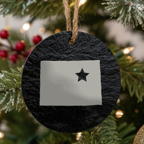 Colorado round slate Christmas ornament engraved with the state shape and a star