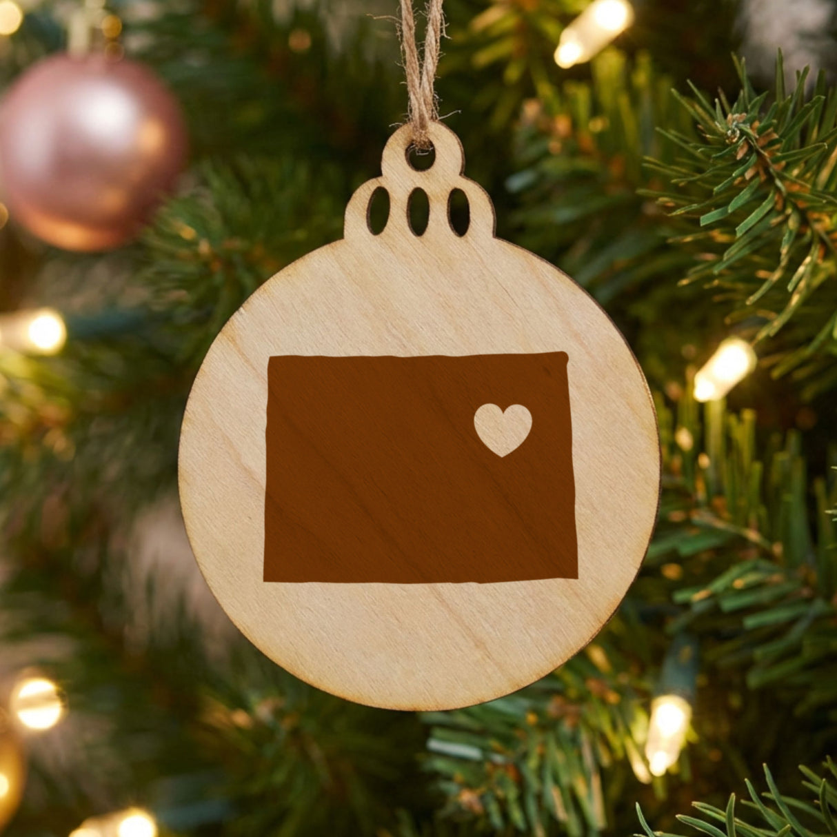 Colorado round wood Christmas ornament engraved with the state shape and a heart