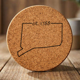 Connecticut round cork coaster engraved with the state outline and est. 1788