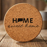 Connecticut round cork coaster engraved with HOME sweet home using the state shape as the letter O