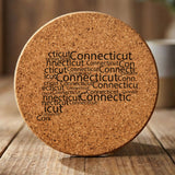 Connecticut round cork coaster engraved with a word cloud of repeating Connecticut text