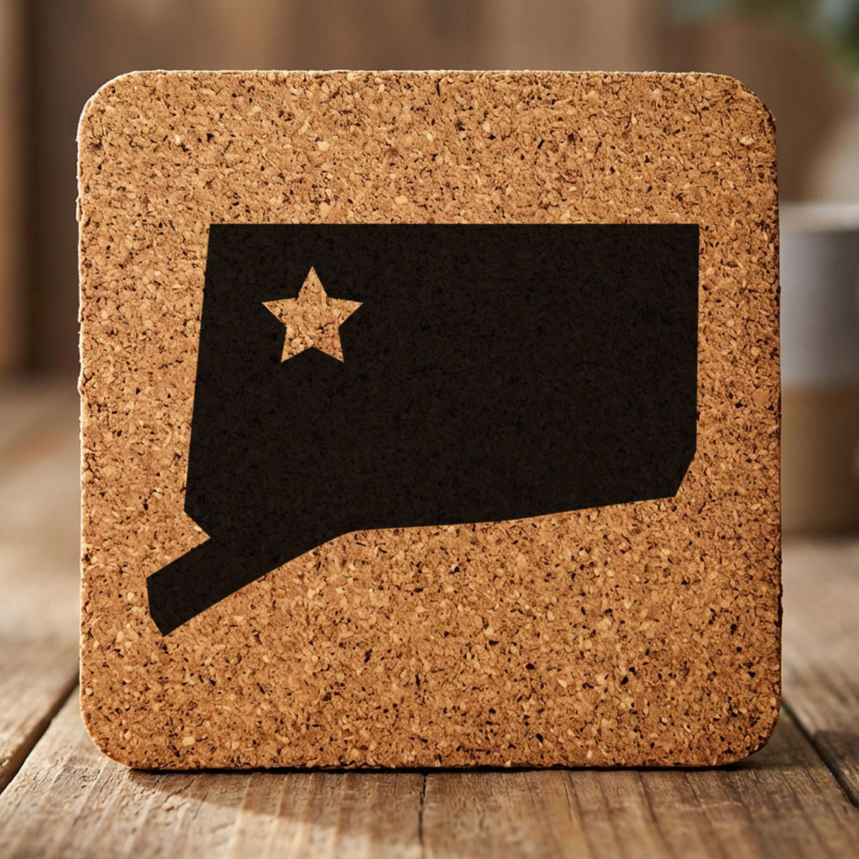 Connecticut square cork coaster engraved with the state shape and a star