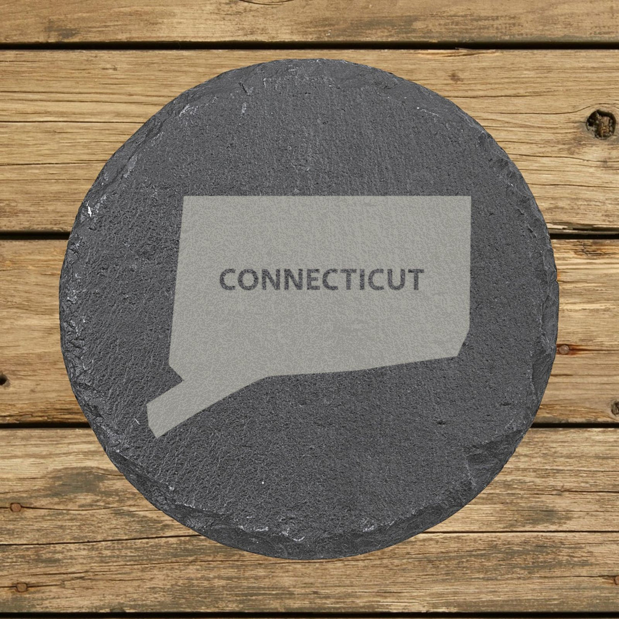 Connecticut round slate coaster engraved with the state shape and CONNECTICUT in bold lettering