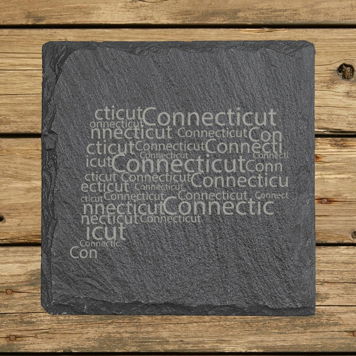 Connecticut square slate coaster engraved with a word cloud of repeating Connecticut text