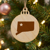 Connecticut round wood Christmas ornament engraved with the state shape and a star