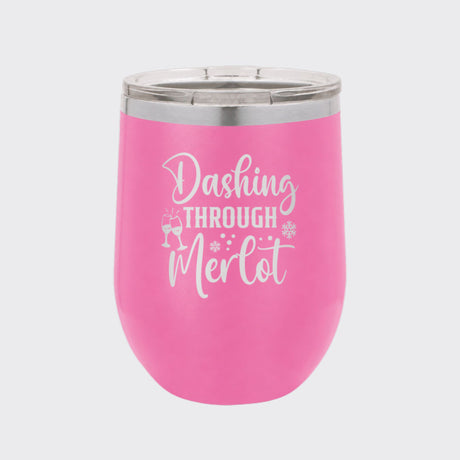 Pink 12 oz stemless wine tumbler laser engraved with "Dashing Through Merlot"
