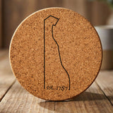 Delaware round cork coaster engraved with the state outline and est. 1787