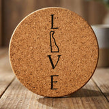 Delaware round cork coaster engraved with LOVE stacked vertically using the state as the letter O