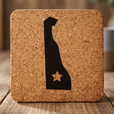 Delaware square cork coaster engraved with the state shape and a star