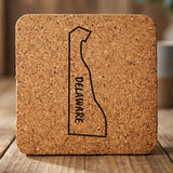 Delaware square cork coaster engraved with the state outline and DELAWARE running vertically
