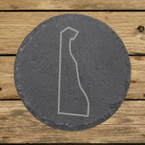 Delaware round slate coaster engraved with a clean state outline