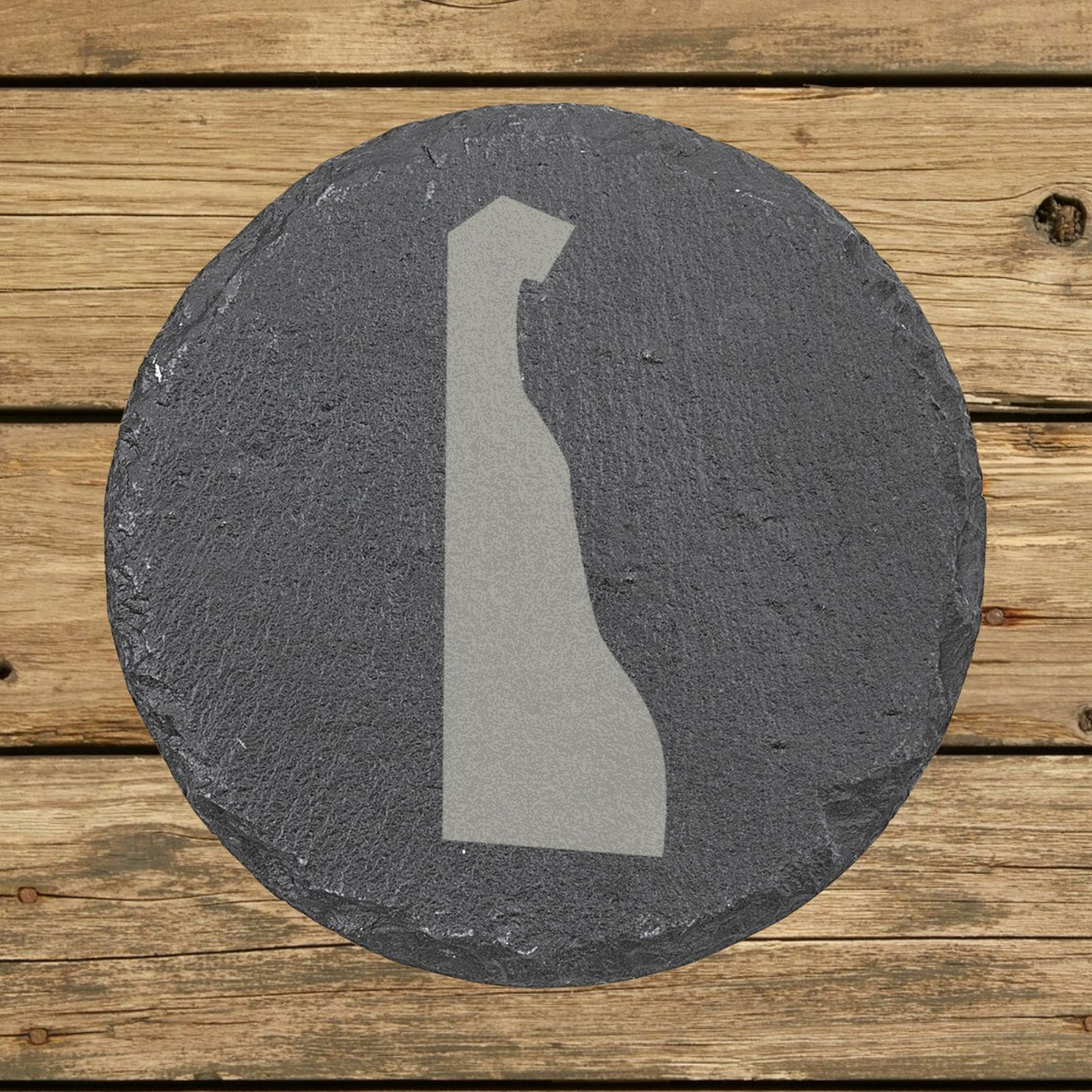 Delaware round slate coaster with the full state shape engraved