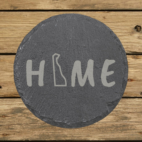 Delaware round slate coaster engraved with HOME using the state outline as the letter O
