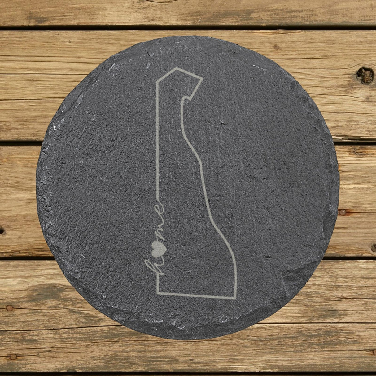Delaware round slate coaster engraved with the state outline and home in script with a heart