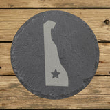 Delaware round slate coaster engraved with the state shape and a star