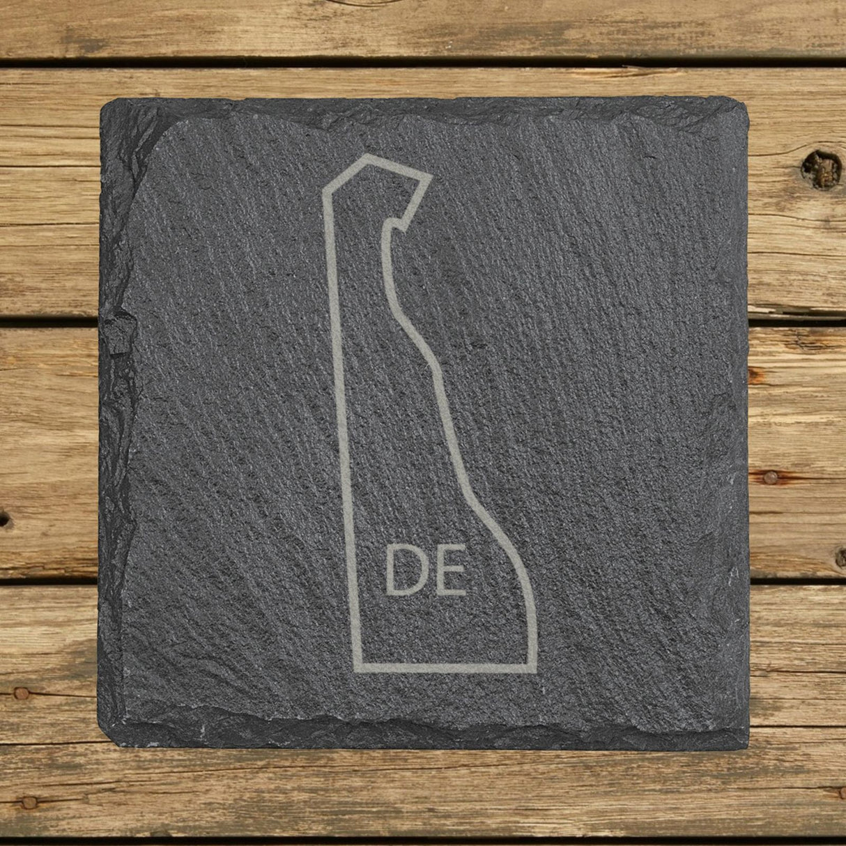 Delaware square slate coaster engraved with the state outline and DE initials