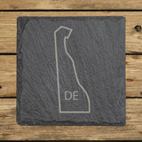 Delaware square slate coaster engraved with the state outline and DE initials