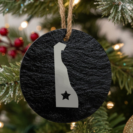 Delaware round slate Christmas ornament engraved with the state shape and a star