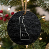 Delaware round slate Christmas ornament engraved with the state outline and DE initials