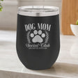Black 12 oz stemless wine tumbler laser engraved with the Social Club "Dog Mom" design, on a kitchen counter