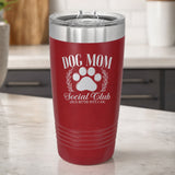 Maroon 20 oz tumbler laser engraved with the Social Club "Dog Mom" design, on a kitchen counter