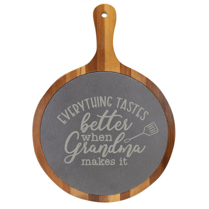 "Everything Tastes Better When Grandma Makes It" Round Acacia Wood/Slate Cutting Board - Laser Engraved