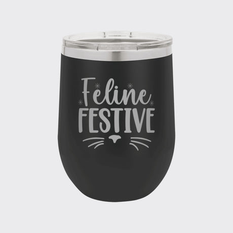 Black 12 oz stemless wine tumbler laser engraved with "Feline Festive"