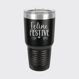 Black 30 oz tumbler laser engraved with "Feline Festive"