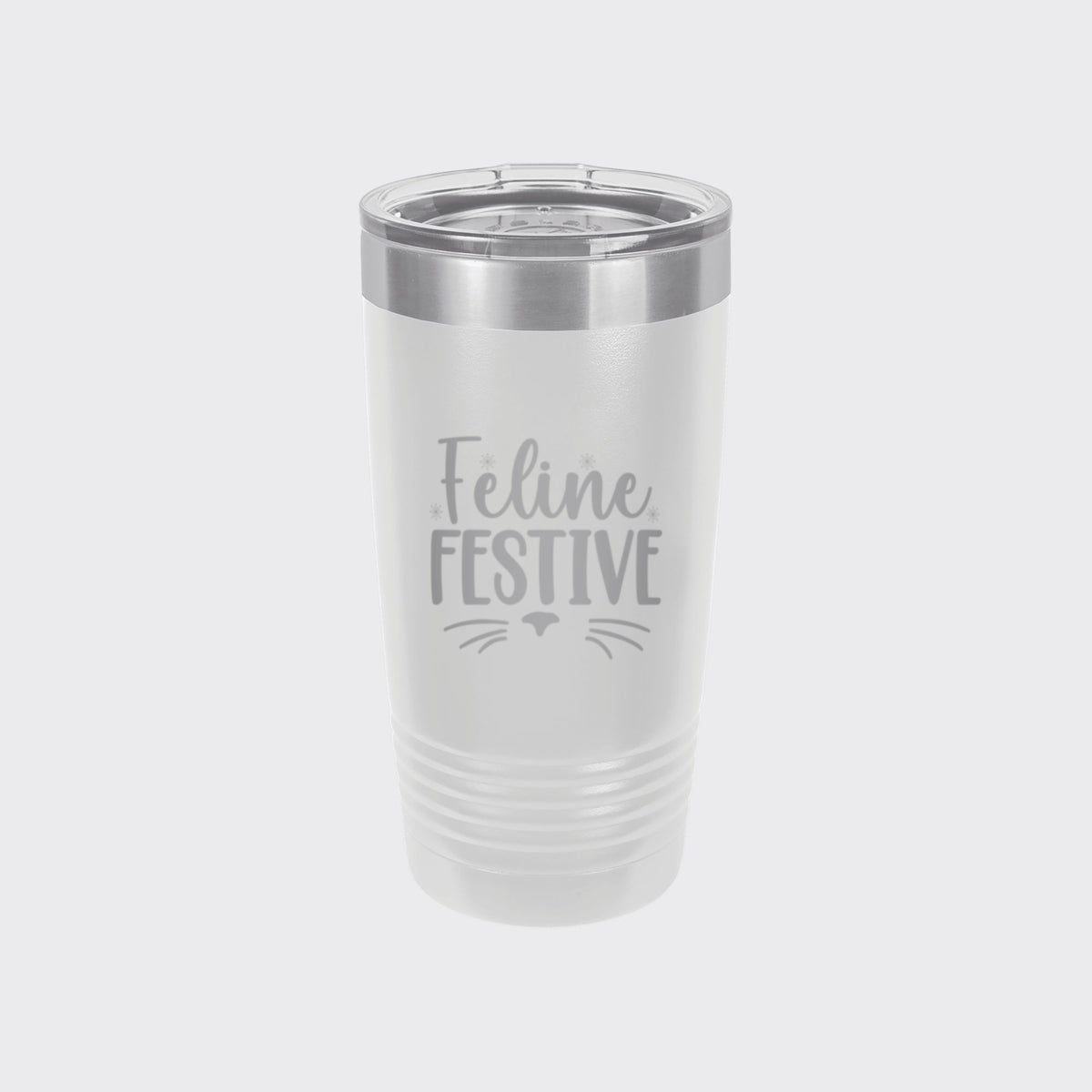 White 20 oz tumbler laser engraved with "Feline Festive"