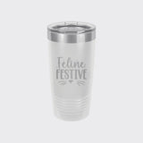 White 20 oz tumbler laser engraved with "Feline Festive"