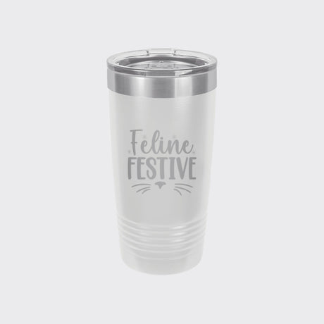 White 20 oz tumbler laser engraved with "Feline Festive"