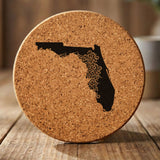 Florida round cork coaster engraved with the state shape in ornate floral scrollwork