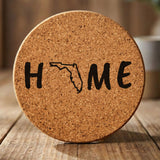 Florida round cork coaster engraved with HOME using the state outline as the letter O