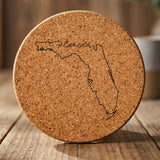 Florida round cork coaster engraved with the state outline and Florida in script lettering