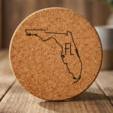 Florida round cork coaster engraved with the state outline and FL initials